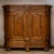 Baroque oak wardrobe raised on five ball feet, richly carved with compass rose decoration and elaborate ornamental details...