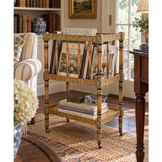 A charming circa-1960s Canterbury book stand with a beautifully aged painted finish, faux-bamboo detailing, and delicate...
