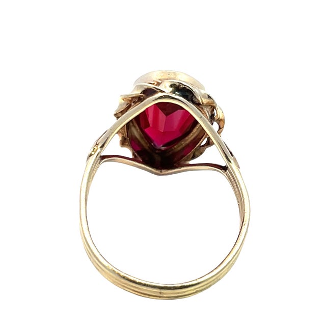 Elevate your jewelry collection with this stunning pear-shaped garnet ring, beautifully set in luxurious 14k yellow gold....