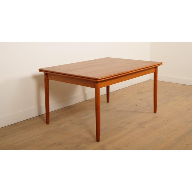 A stunning vintage Danish dining table of exceptionally generous proportions. It is precisely these generous dimensions...