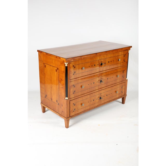 Original cherrywood chest of drawers, beautifully inlaid with strapwork and geometric marquetry on the top, sides, and...