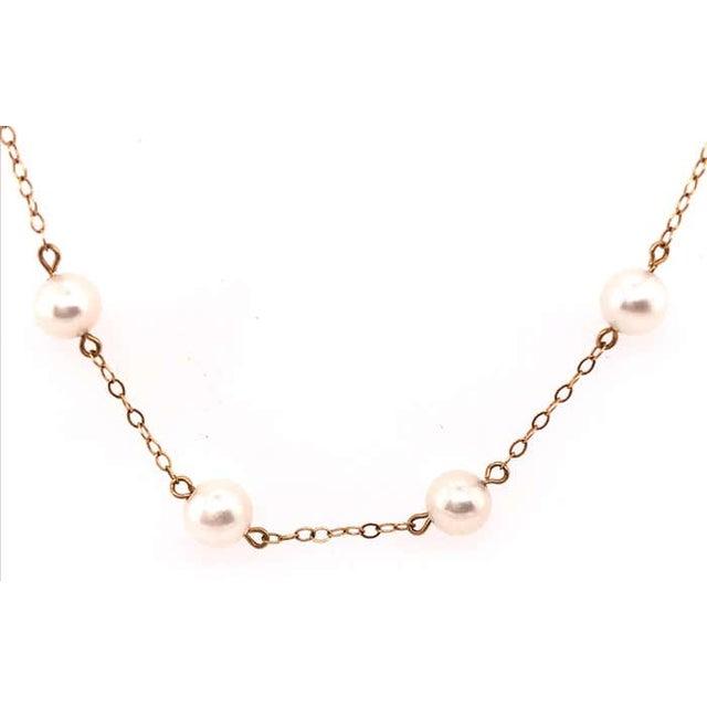 14 Karat Yellow Gold 17 inch Peter Brown Pearl And Gold Link Necklace 6.1 grams total weight.