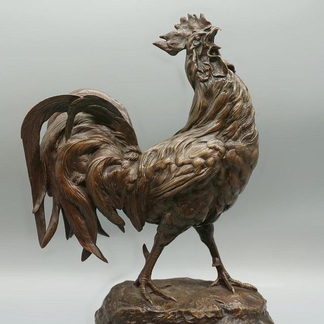 A late 19th century bronze sculpture of a strutting rooster by alfred barye (1839-1882) set over original bronze base and...