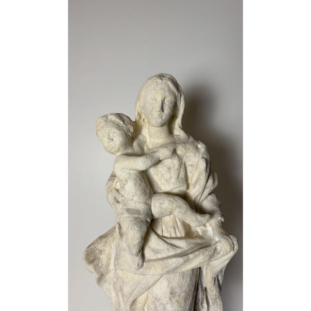 Madonna and Child in statuary marble from the late 16th century. This sculpture from Emilia (Italy), which depicts a very...