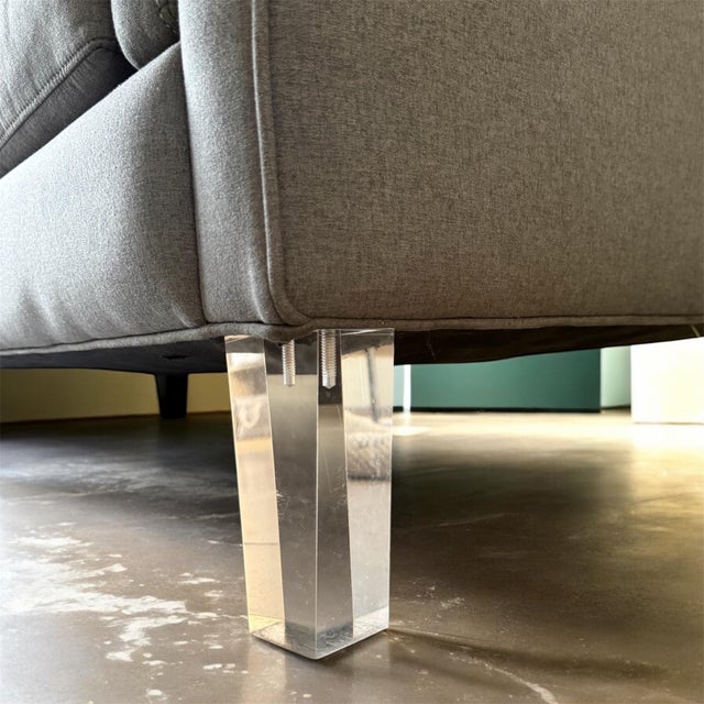 this modern grey tufted sofa embodies clean architectural lines and a refined contemporary aesthetic. Selected for its...