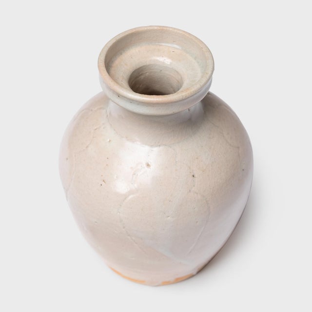 This petite Chinese vase has a bottleneck form that follows traditional vessels used for storing oil, condiments or...
