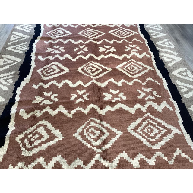 Handwoven European Art Deco rug, likely Romanian or Hungarian, circa early to mid 20th century (c. 1920-1940). The design...