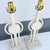 A striking pair of Mid-Century Modern sculptural table lamps showcasing bold geometric artistry and architectural...
