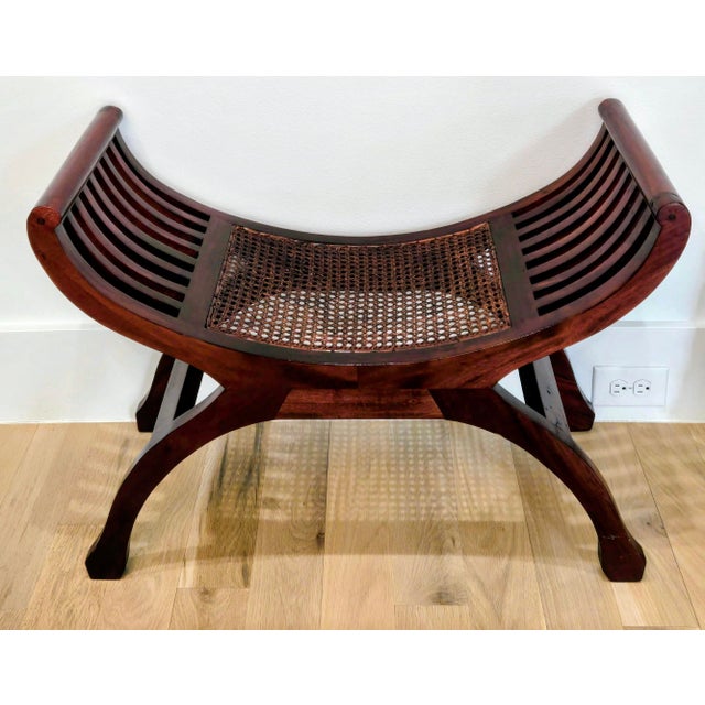 A handsome vintage Roman-inspired curule bench with a graceful, sculptural silhouette. Sweeping X-form legs support a...