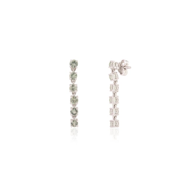 This is part of Chairish’s Fine Jewelry assortment. These stunning 14K white gold dangle earrings showcase round-cut green...