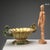 Lustred majolica centerpiece with a ribbed body and animal-shaped handles. Manufacturer's mark under the base. This piece...