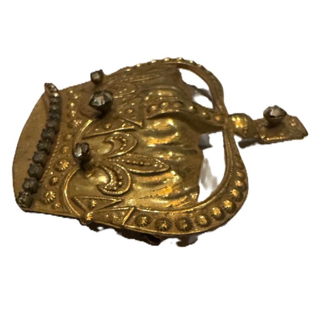 This striking vintage crown brooch is a signed example by renowned costume jewelry designer Miriam Haskell, celebrated for...