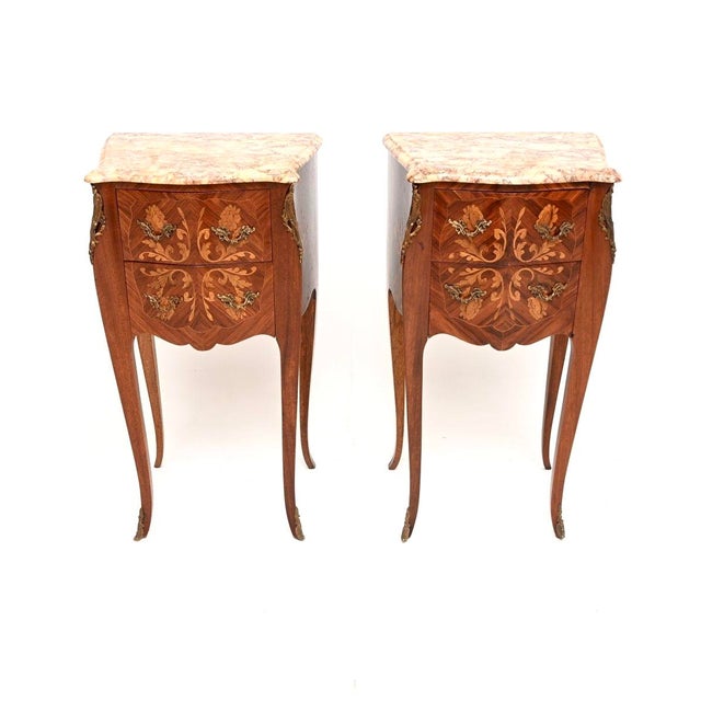 A stunning pair of antique French inlaid marble top bedside chests. They were made in France and date from around the...