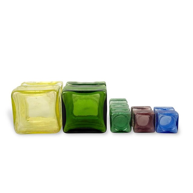 1960's Finnish blown glass vases designed by Helena Tynell and produced by Riihimaen Lasi. This set features "Pala" vases,...