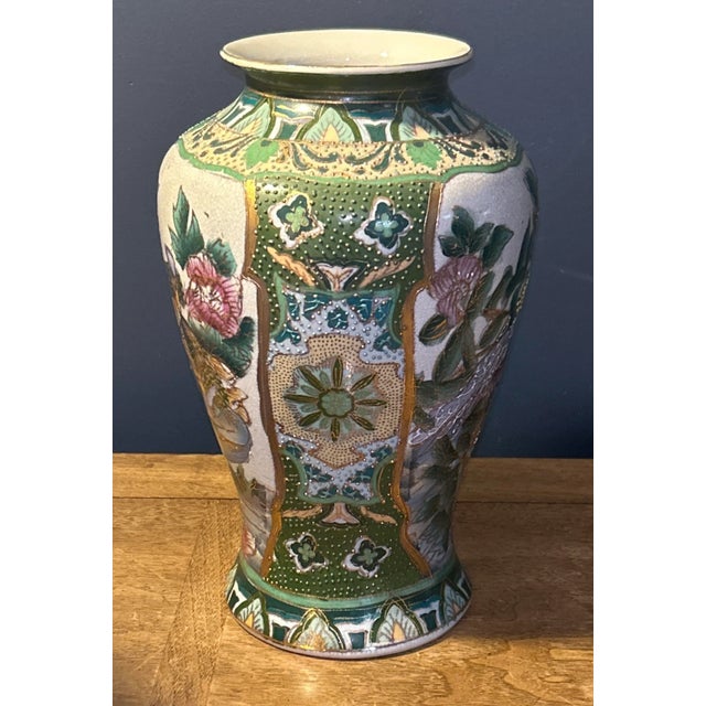 This vintage Japanse vase, adorned with pheasants, flowers, gold trim, and moriage detail, extraordinary design and...
