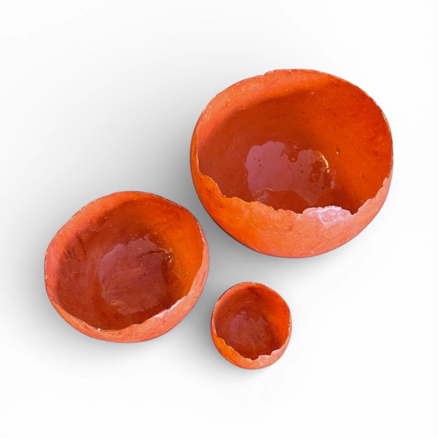 A set of three vintage nesting bowls in a very thin marbled terracotta. Intended to be decorative rather than functional....