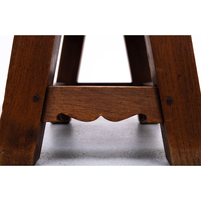 Very nice chunky Brutalist Ottoman . Hand made Wood pins Solid Oak frame and comes with a Thick Leather top . 1950s...