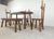Sturdy and handcrafted dining set with a bench and three high back dining chairs. This striking design and 'rough' hand...