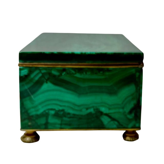 A beautiful 19th century decorative box featuring richly figured natural malachite with striking variations of deep and...