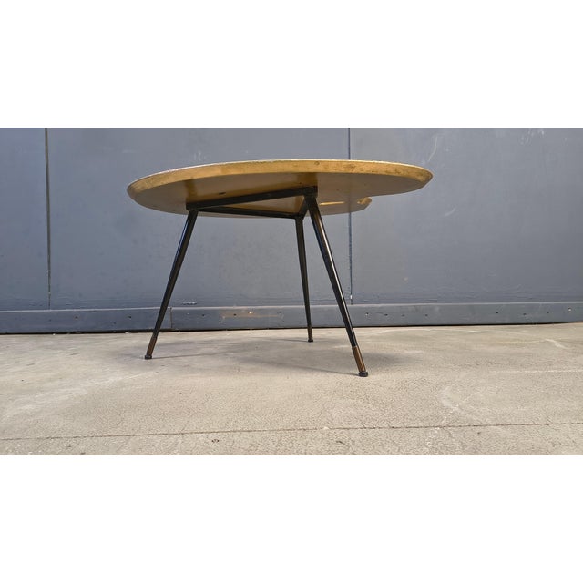 Mid century palette shaped coffee table with a parisian print from the mid century. Elegant italian design coffee table...