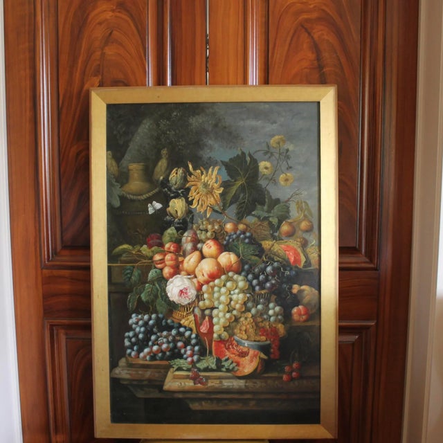 A very handsome still life oil painting in the 17th century manner, depicting luminous fruits: peaches, grapes,...