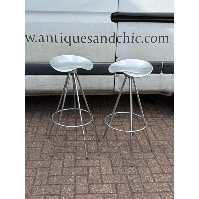 A pair of Aluminium & Chrome Jamaica Stools, design by Pepe Coates for Amat. 80.5 cms tall. A used item so will have signs...