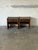 This pair of nightstands features a rustic plank construction with built-in storage drawers and lower shelves. The boxy...