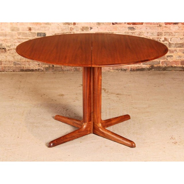 Danish Mid Century extending rosewood dining table by Dyrlund, circa 1970s. Extends to 170cm to seat up to 8 people....