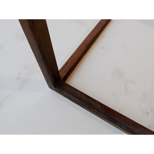 Rosewood planter designed by aksel kjersgaard and produced in denmark, c. 1960s. the planter is executed in rosewood with...