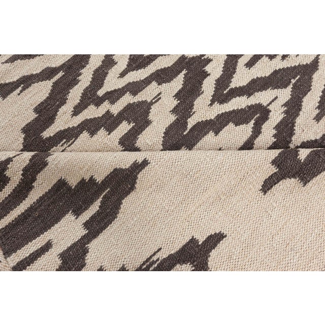 Bold, rhythmic, and rooted in tradition, this Modern Swedish Flat Weave Rug is a dynamic statement piece that balances...