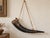 A striking vintage Colonial-style powder horn featuring a naturally curved dark bovine-horn body, turned wood pouring...