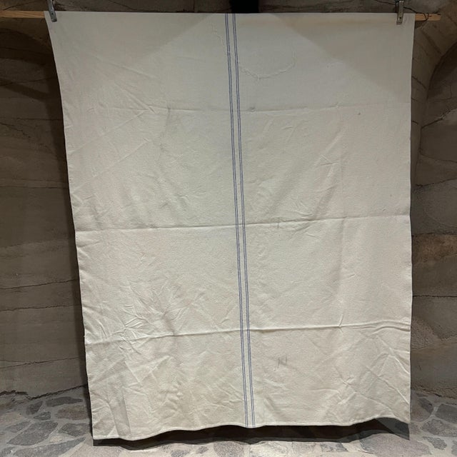 AMBIANIC presents Vintage Old Wool Blanket off white with blue line stripe 68 w x 92 Preowned original condition Refer to...