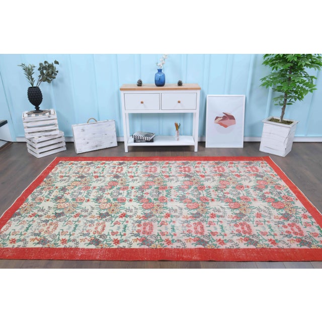 Vintage Turkish Hand-Knotted vintage rug is a semi-Vintage area rug.'70s Eastern region of Turkey's unique rug is...