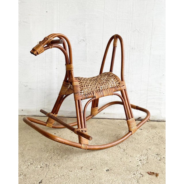 An absolutely fabulous sculptural mid century modern Italian wicker and rattan rocking horse by designer, Franco Albini....
