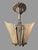 Beautiful matching pair of antique Art Deco two-light ceiling fixtures, circa 1920s–1930s, featuring ornate cast metal...