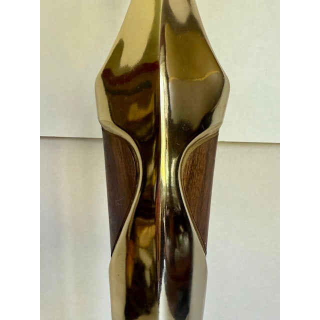 Here is a sculptural circa 1960 table lamp attributed to Laurel Lamp Company, featuring a dramatically tapered brass-...
