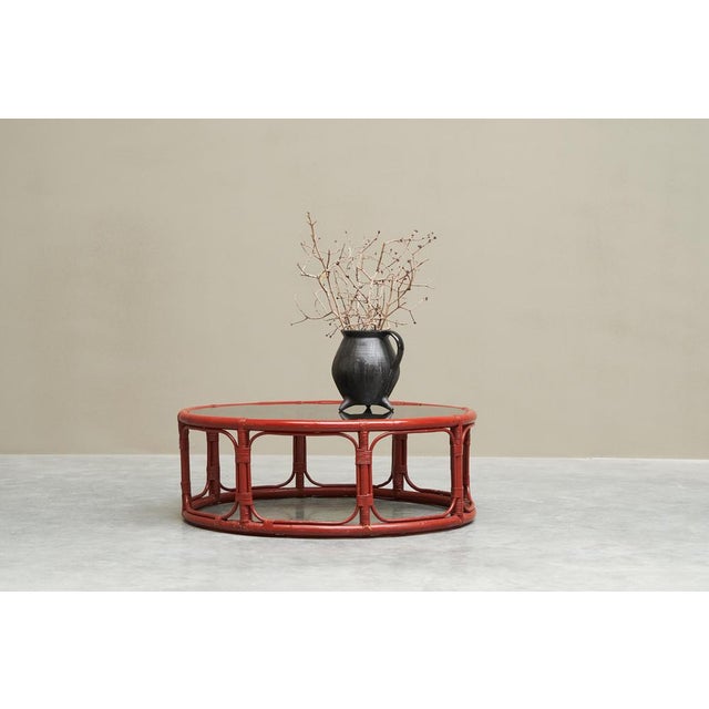 Sang de Boeuf' Red Lacquered Bamboo and Smoke Glass Coffee Table Mid 20th Century. This is a very distinct mid century...