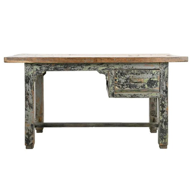 Vintage Patinated Wood Desk, in Good conditions. This piece is designed in the style of the selected designer and/or...
