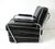 A superb quality Art Deco chrome framed streamline lounge chair with black leatherette upholstery having off white piping...