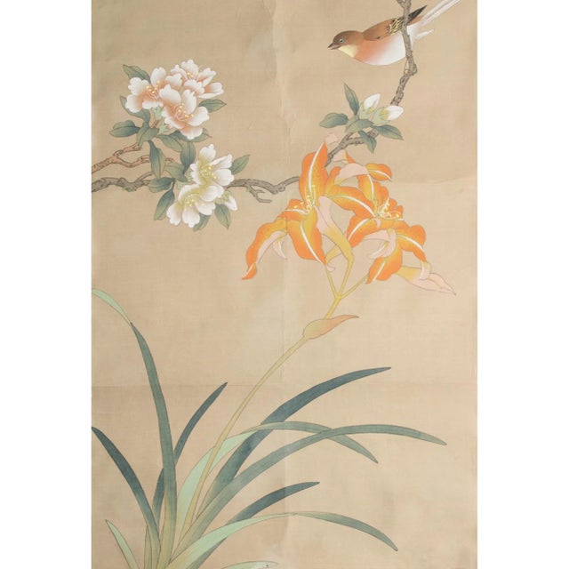 Lovely vintage Japanese silk scroll mounted on paper depicts Long-tailed Rosefinch on the branch of Camellias and Lilies....