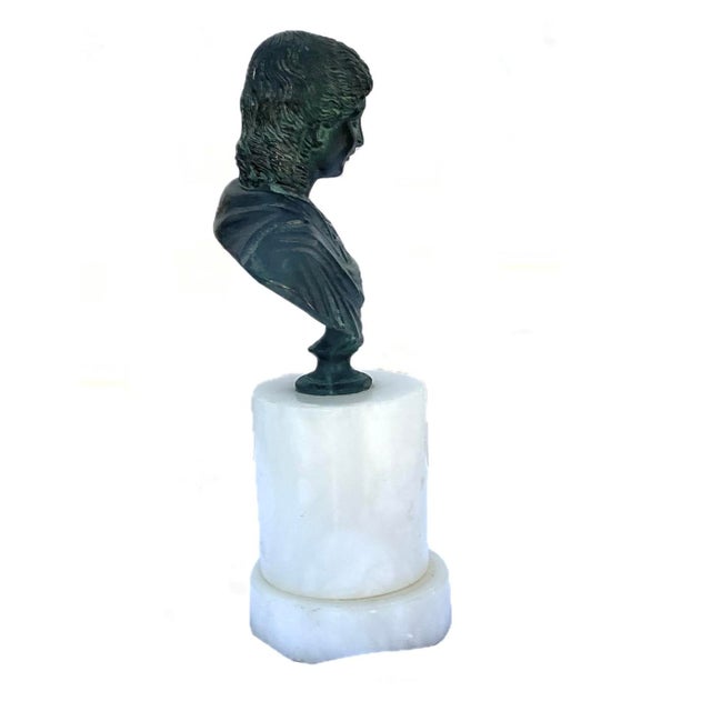 Grand Tour Bronze Portrait Bust of a Roman Goddess. The sculpture presents an intricately carved face with a serene,...
