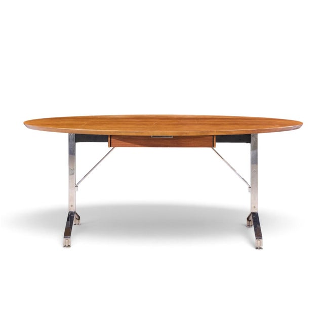 Imperial Mid Century Oval Walnut and Chrome Desk This desk measures: 72 wide x 40.25 deep x 29.5 high, with a chair...