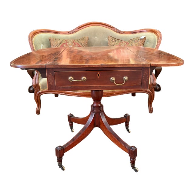 Exhibiting exceptional craftsmanship, this multi-functional piece—perfectly sized as a sofa table, occasional breakfast...
