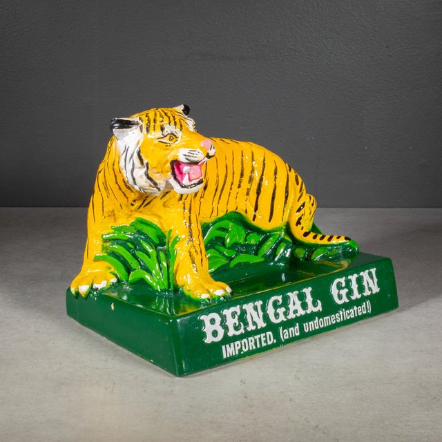 ABOUT A mid-century Tiger chalkware advertising display was used to hold a bottle of Bengal Gin at a bar or restaurant...