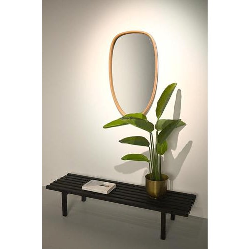 Organically formed mirror in a bent wooden frame. This vintage mirror is made in Germany and is in good vintage condition....