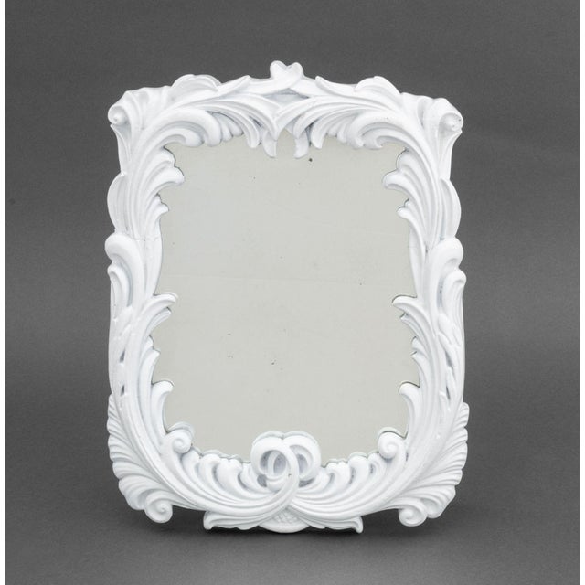 Serge Roche Style White Painted Composite Wall Mirror, with scrolling foliate motifs, unmarked. Overall: 15" H x 11" W x...