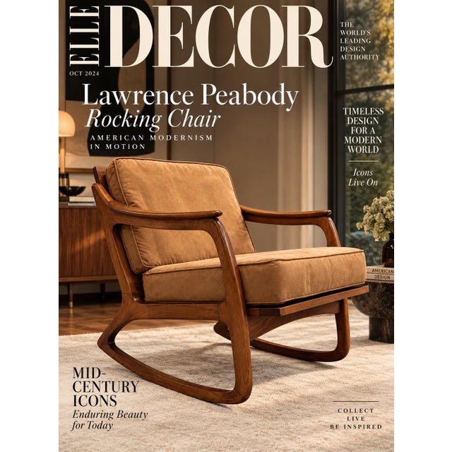 This mid-century modern rocking chair features a sculpted solid walnut frame with fluid, organic armrests and continuous...