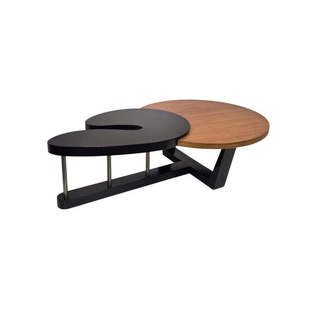 A striking interplay of organic form and architectural precision, this sculptural original coffee table combines a richly...