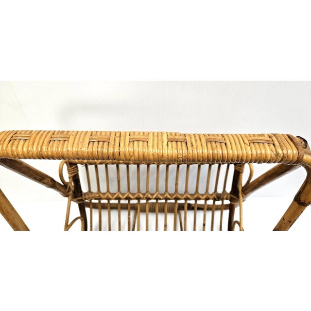 Vintage MCM Rattan Wicker 19" Magazine Rack Stand inspired with a Franco Albini Style! This sculptural piece blends mid-...