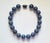 The length of the necklace is 17.5 inches (44.5 cm). The size of the smooth round beads is 21-22 mm. The lapis lazuli...